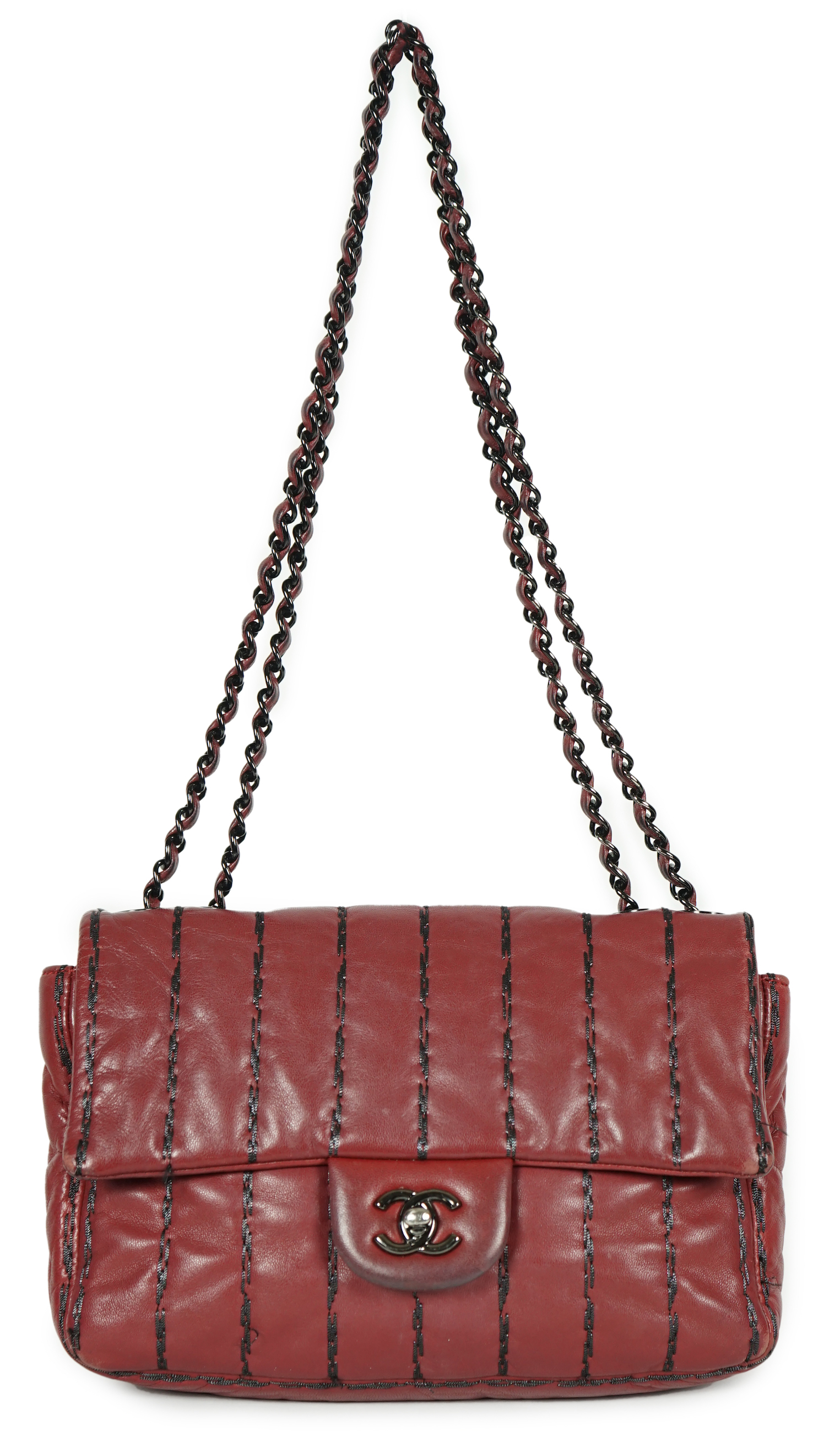 A Chanel Classic Jumbo Flap burgundy lambskin quilted shoulder bag, with pinstripe stitching, height 18cm, overall height 48cm, width 25cm, depth 6cm, Please note this lot attracts an additional import tax of 20% on the